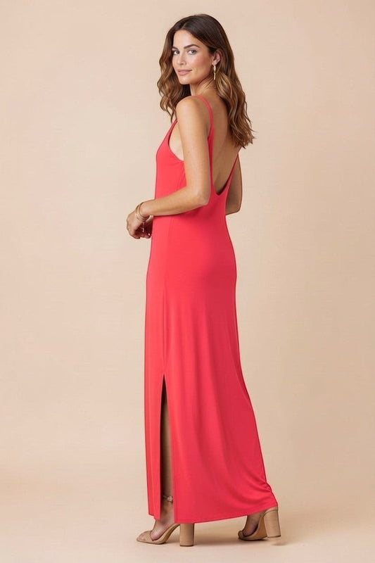 Osanna Creazione coral red maxi dress with thin straps, V-neck, low back, and side slit. Model is wearing size one size.