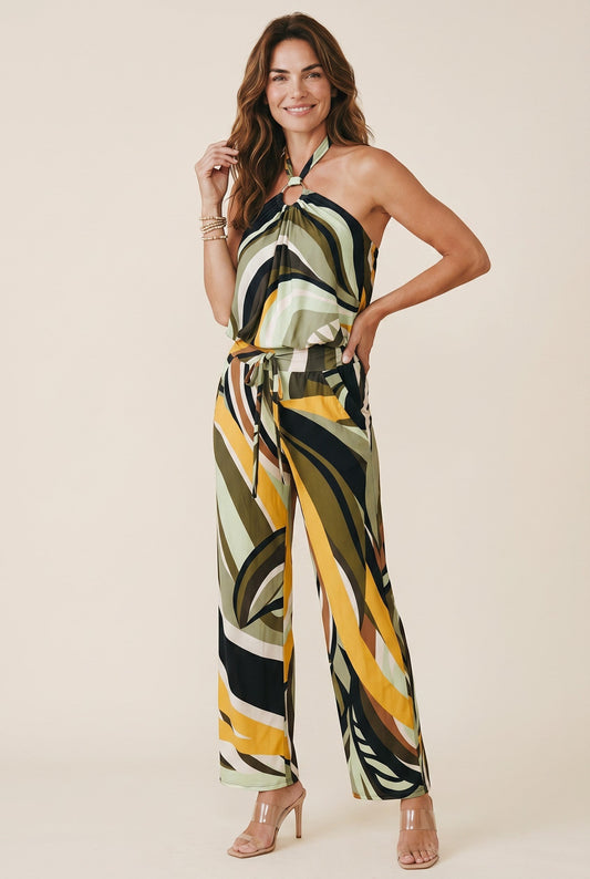 Osanna Creazione Prenalisse halter neck jumpsuit with wide-leg pants in a green, yellow, and black abstract print.