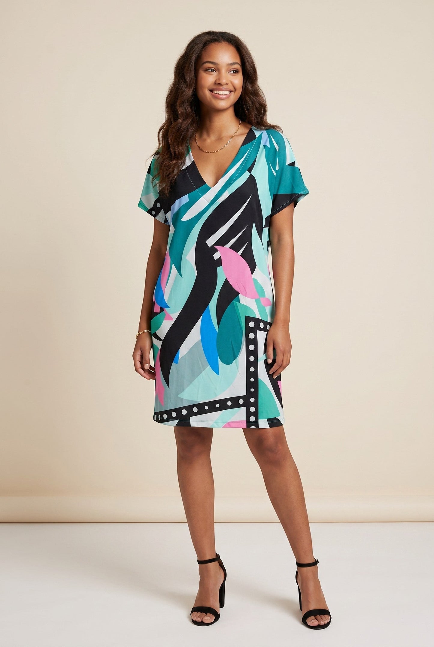 Osanna Creazione Abi short straight dress with V-neck, short sleeves, and a colourful abstract print in teal, black, pink, and blue. Includes a belt.