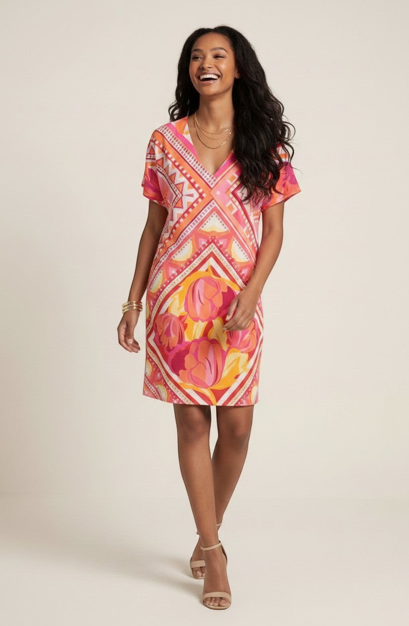 Osanna Creazione Abi short straight dress with V-neck, short sleeves, and a vibrant pink, orange, and yellow floral and geometric print. Includes a matching belt.