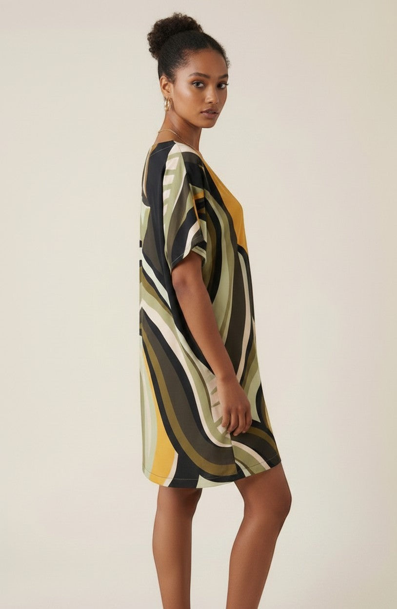Osanna Creazione Abi short straight dress with V-neck, short sleeves, and a fluid print in green, yellow, and black.