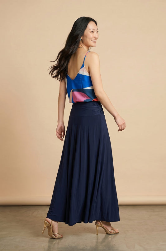 Osanna Creazione abstract print camisole with thin straps and V-neck, paired with a navy blue maxi skirt.