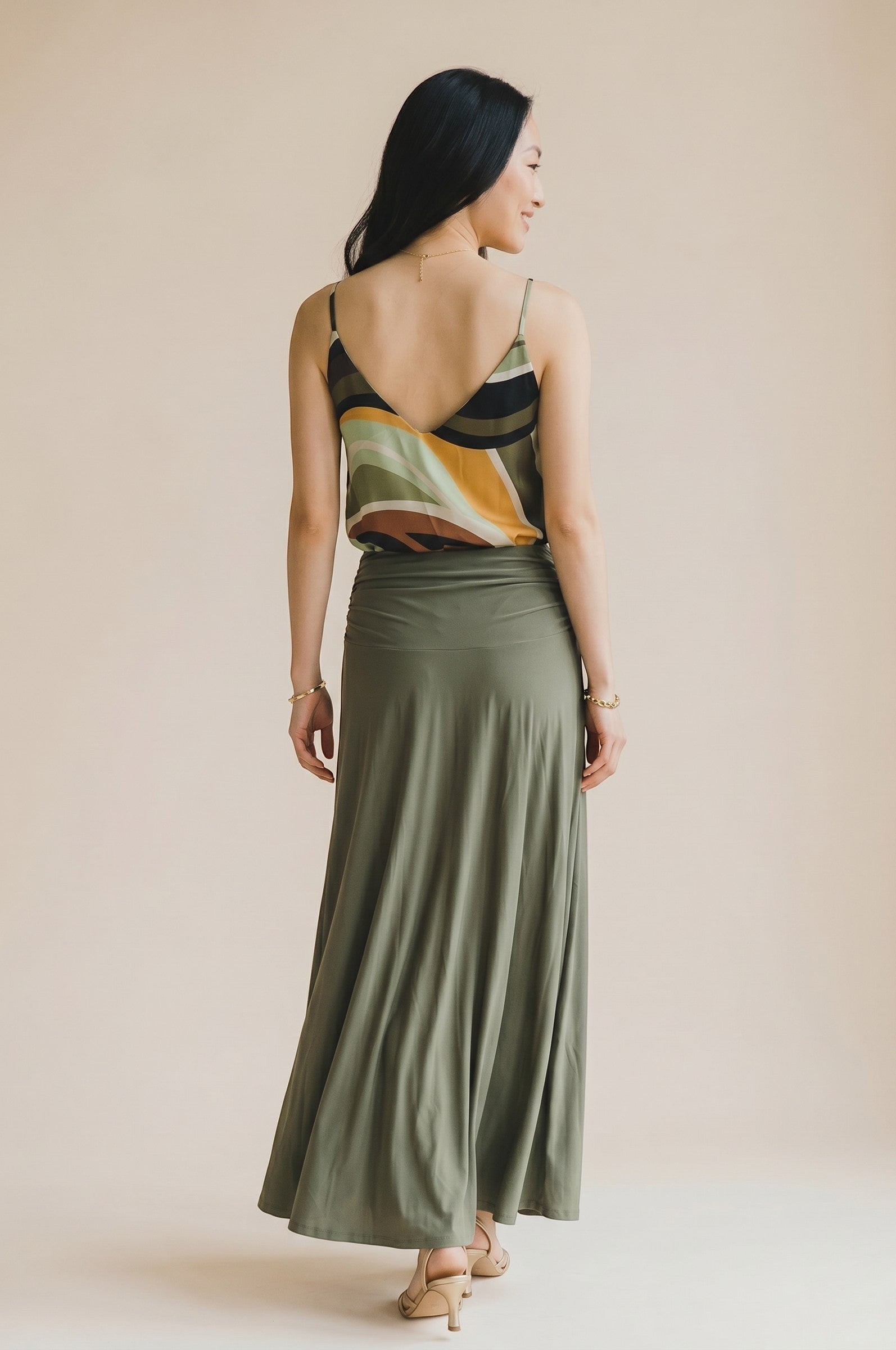 Osanna Creazione women's fluid V-neck camisole with abstract wavy print in green, yellow, black, and white.