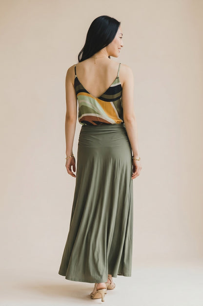 Osanna Creazione women's fluid V-neck camisole with abstract wavy print in green, yellow, black, and white.