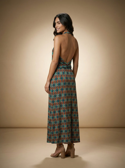 Osanna Creazione Batta long halter neck dress with a deep open back and a flowing draped neckline. Features a geometric print in teal and brown.