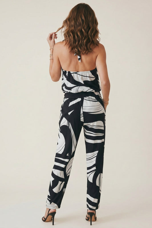 Osanna Creazione black and white abstract print halter neck jumpsuit with wide-leg pants and elasticated waist.