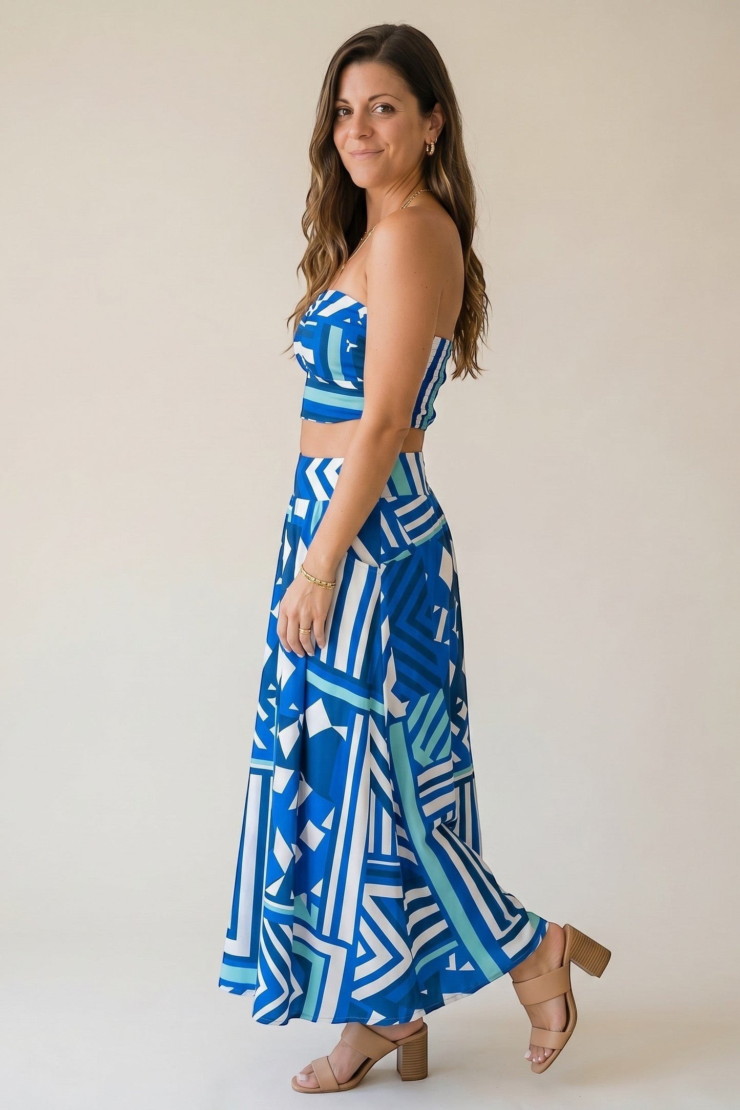 Osanna Creazione blue and white abstract print maxi skirt with pockets, worn high-waisted by a model.