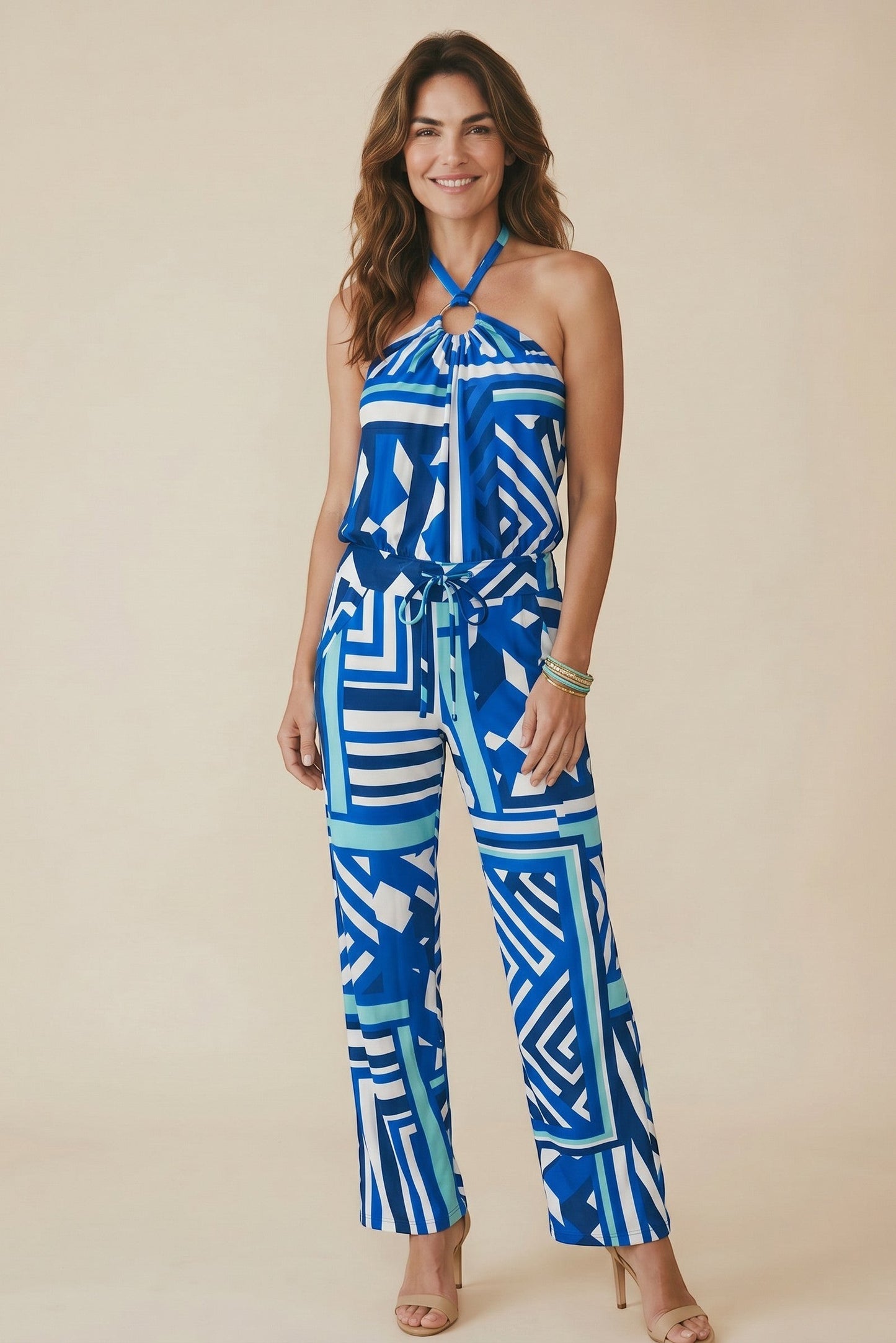 Osanna Creazione blue and white geometric print halter neck jumpsuit with wide legs and a tie waist.