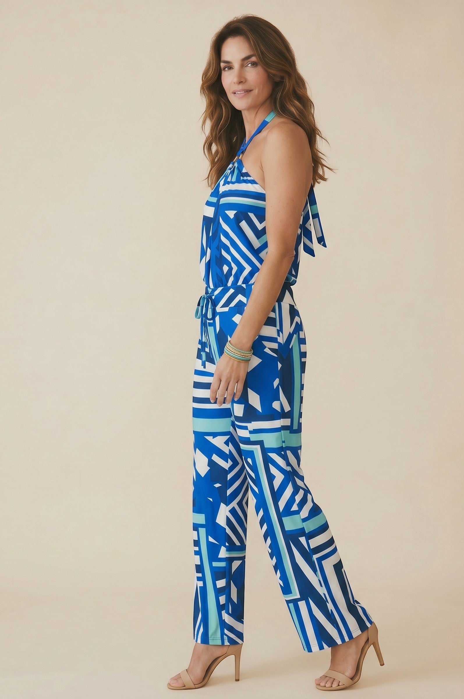 Osanna Creazione blue and white geometric print halter neck jumpsuit with wide-leg pants and a tie waist.