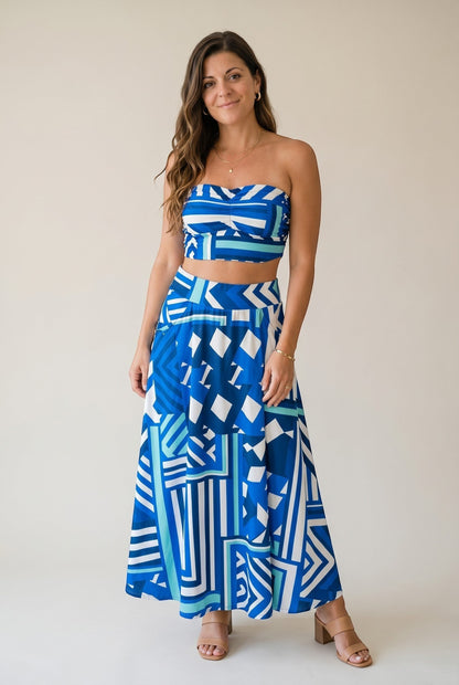 Osanna Creazione blue and white geometric print maxi skirt with pockets, worn high-waisted.