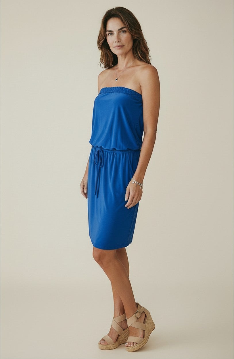 Osanna Creazione blue strapless midi dress with braided bustier detail, drawstring waist, and pockets. Model is wearing wedge sandals.