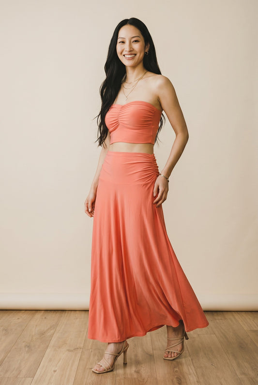 Osanna Creazione coral ruched maxi skirt with a flowing A-line silhouette and comfortable bandeau waist. Versatile 2-in-1 style.