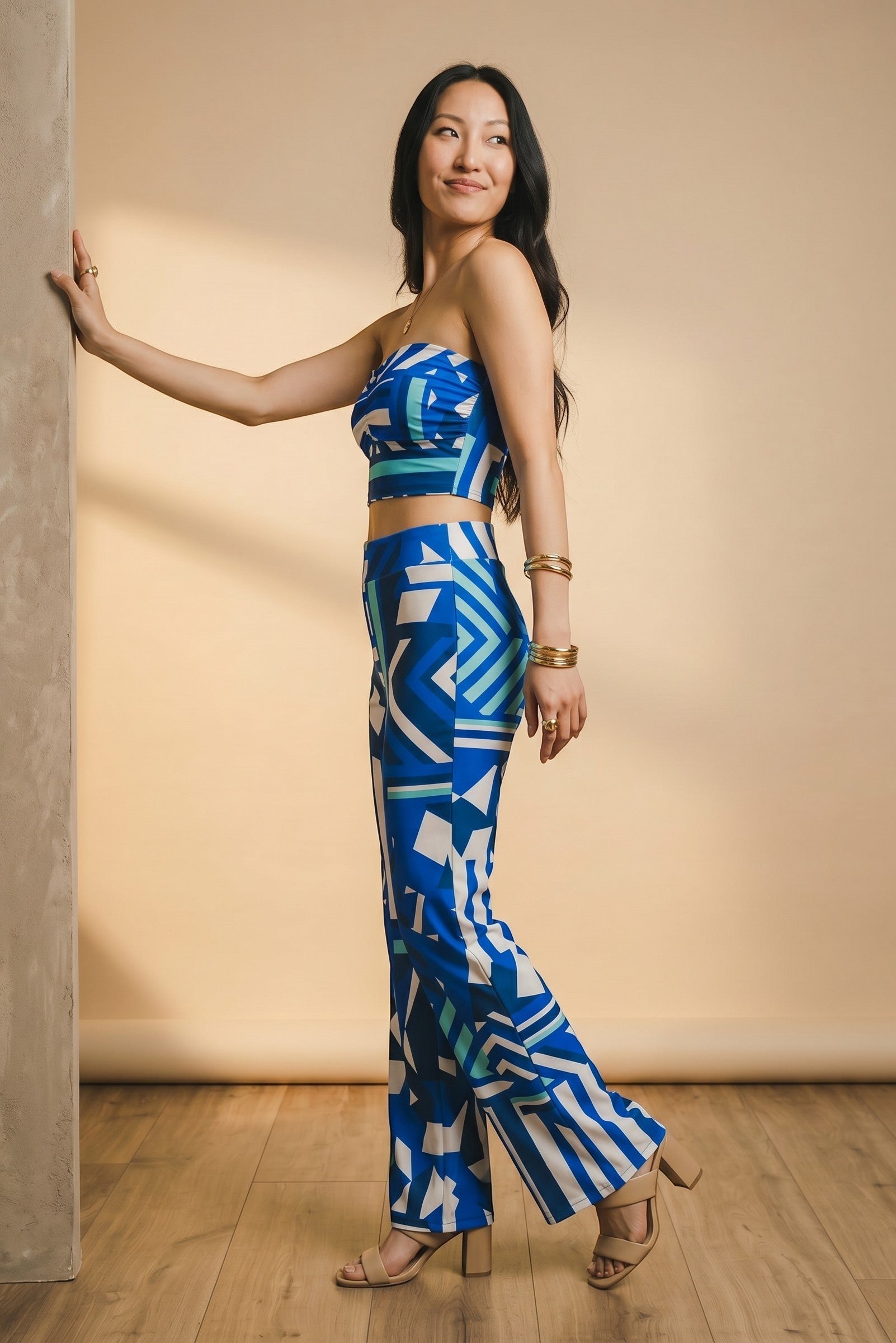 Osanna Creazione fluid wide-leg trousers with abstract blue and white geometric print, elasticated waist.