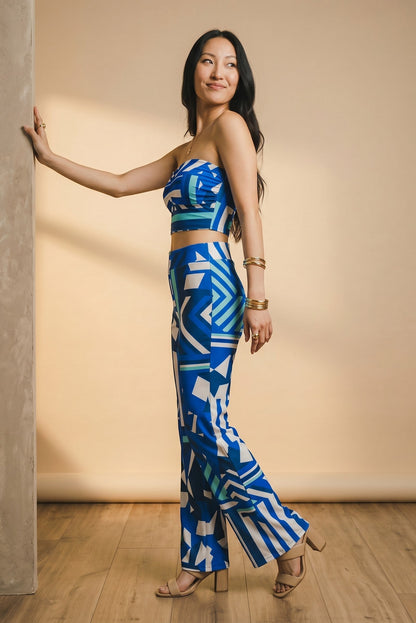 Osanna Creazione fluid wide-leg trousers with abstract blue and white geometric print, elasticated waist.