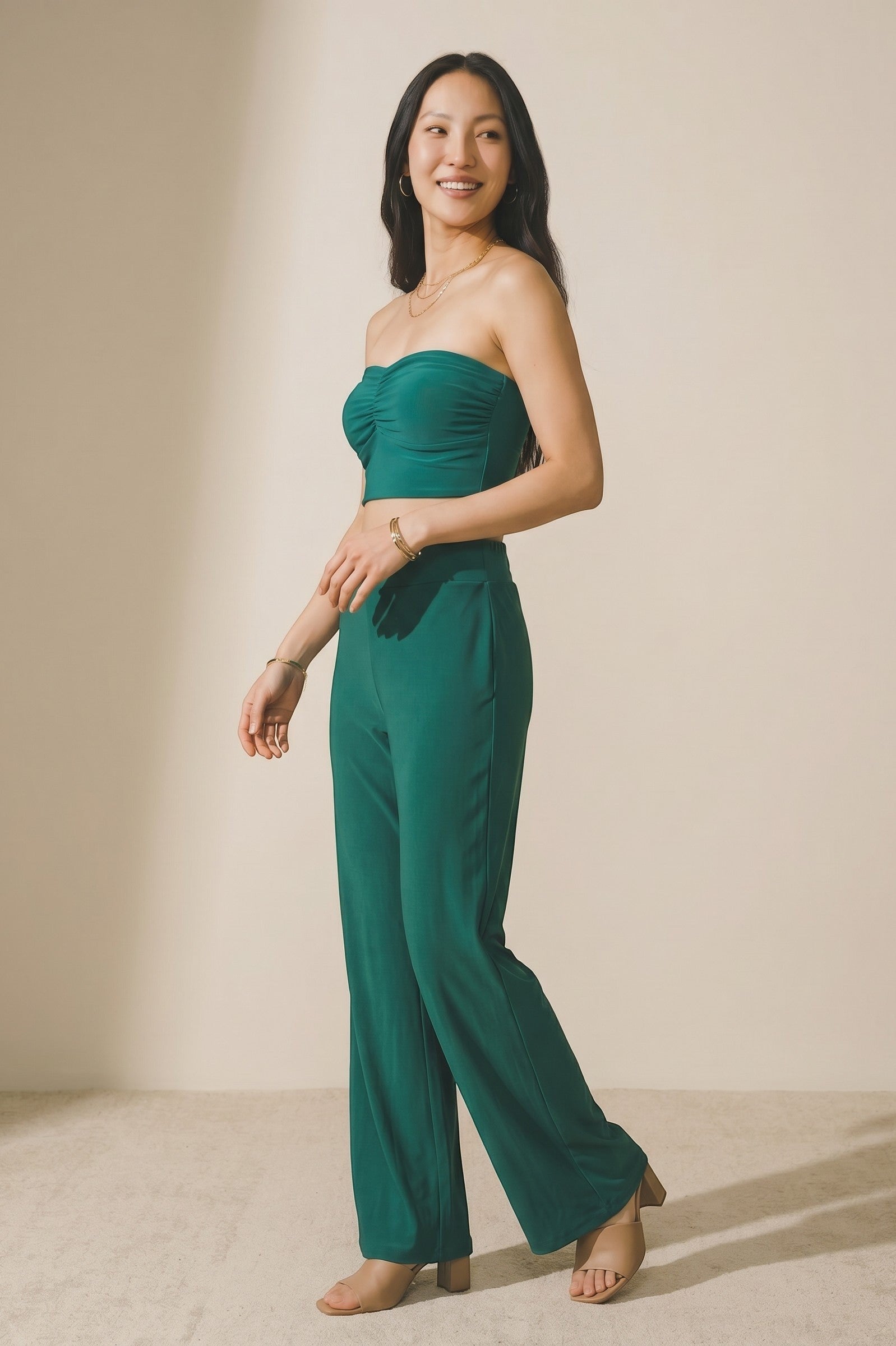 Osanna Creazione fluid green wide-leg pants with elasticated waist, worn by a model.