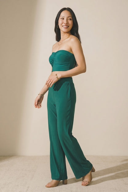 Osanna Creazione fluid green wide-leg pants with elasticated waist, worn by a model.