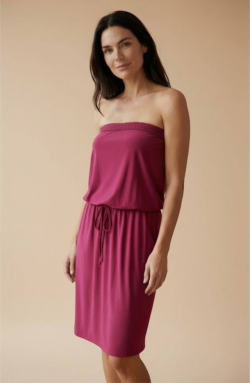 Osanna Creazione magenta strapless midi dress with braided bustier detail, drawstring waist, and pockets.