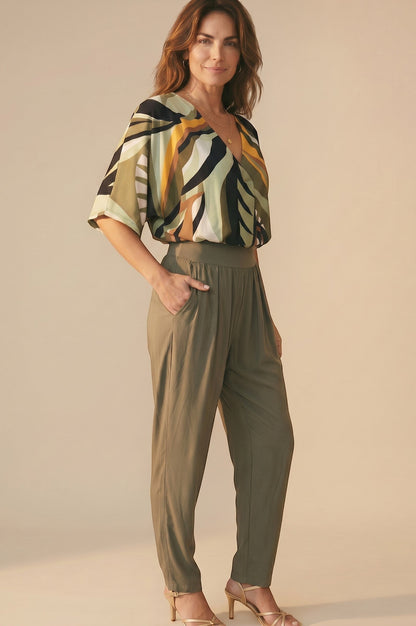 Osanna Creazione olive green fluid fabric tapered trousers with elasticated high waist and side pockets.