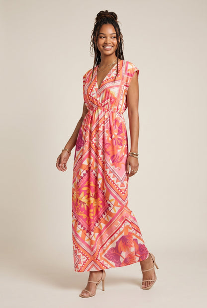 Robe longue empire Baleate Osanna Creazione, imprimé géométrique et floral rose et orange, col V, taille unique.