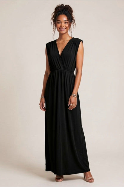 Robe longue noire Baleate Osanna Creazione, coupe empire, col V devant et dos, élastique sous poitrine. Taille unique.